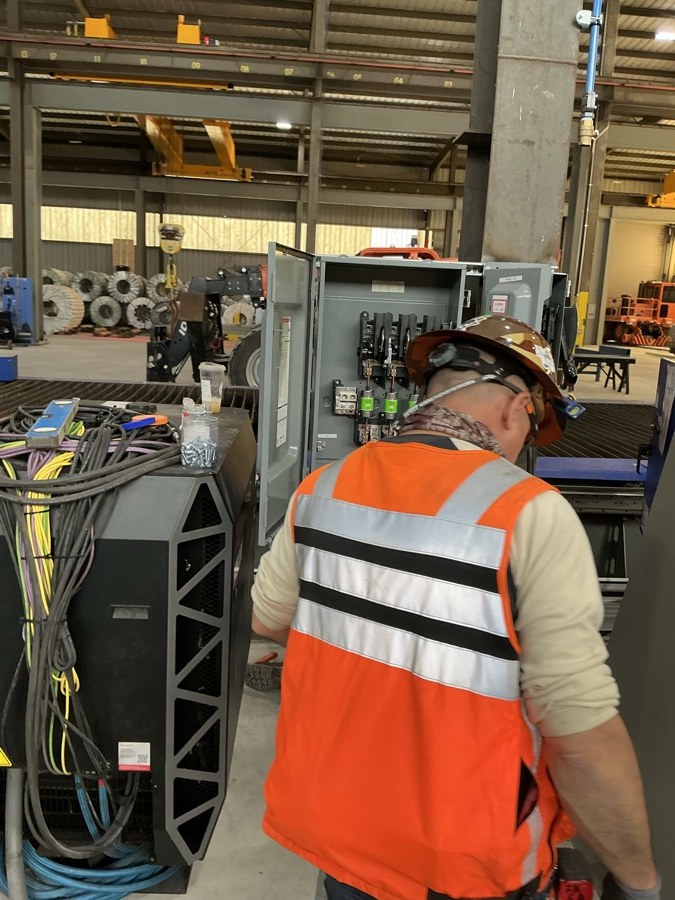 Open electrical enclosure near Hypertherm-branded equipment